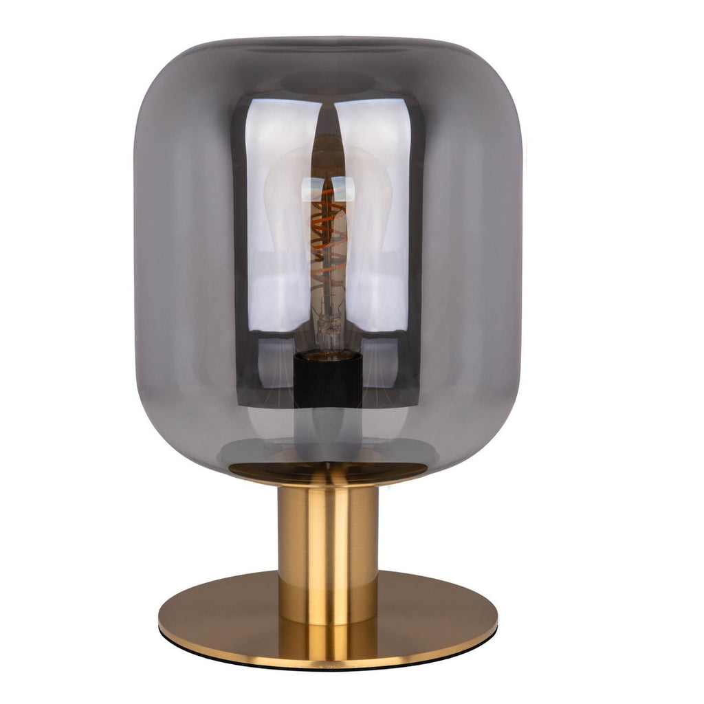 Lampe de table design Alessio, base cylindrique en métal doré et grand abat-jour en verre fumé translucide.
