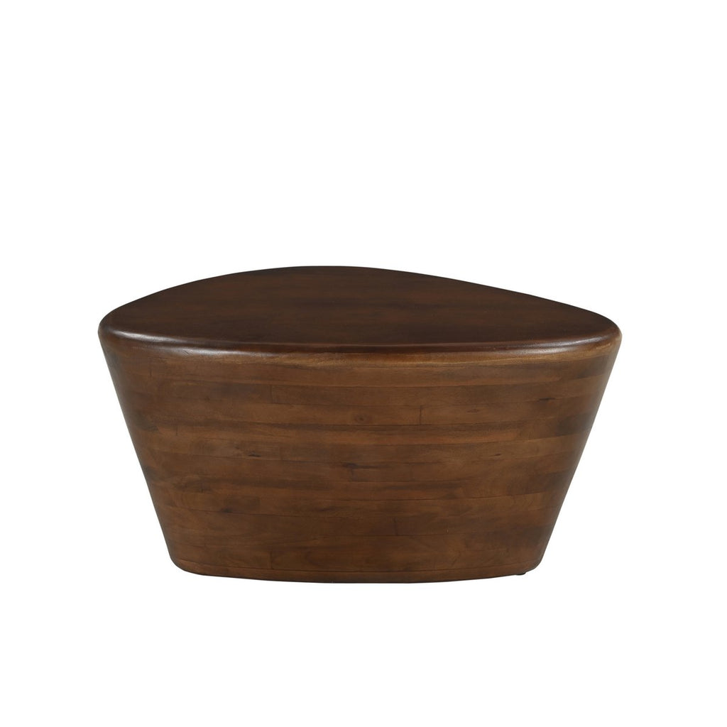 Table basse design en bois de manguier massif avec une forme organique asymétrique rappelant un gros galet.