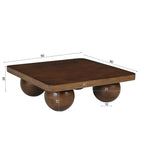 Perspective mettant en valeur les angles adoucis du plateau carré de la table basse.