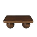 Table basse design en bois de manguier massif avec plateau carré et quatre pieds en forme de boules.
