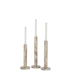Set de 3 bougeoirs cylindriques de tailles différentes en pierre naturelle beige façon marbre.