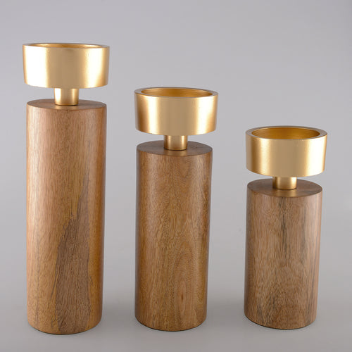 Vue d'ensemble de la collection de bougeoirs cylindriques bois et or.