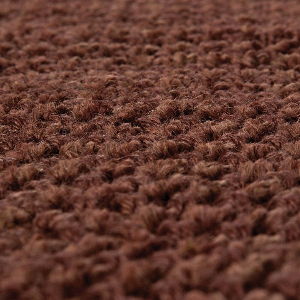 Texture du tissage en jute naturel coloris caramel gros plan.