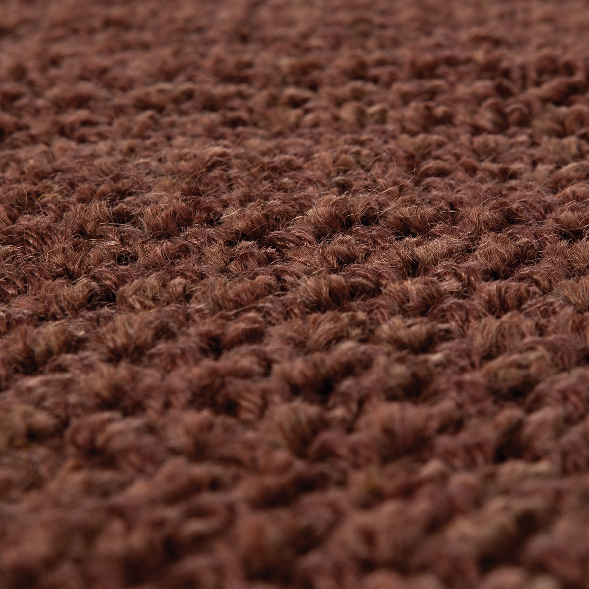 Texture du tissage en jute naturel coloris caramel gros plan.