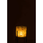 Détail de la texture marbrée du verre vert et du support métallique.